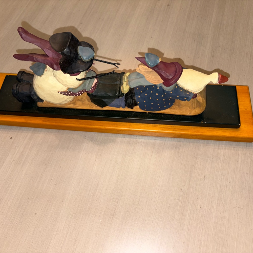 Williraye studio ceramic snowman on a sled